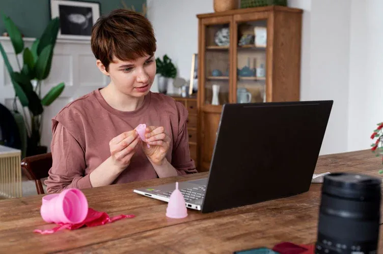 woman using menstrual cup woman using menstrual cup woman using menstrual cup