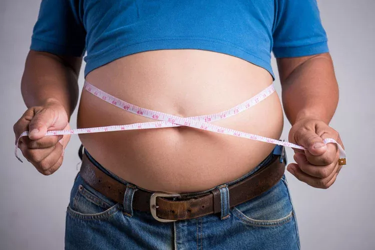 https://tucsonwellnessmd.com/wp-content/themes/yootheme/cache/overweight-fat-adult-man-very-tight-jeans-with-measuring-tape-3015c170.webp