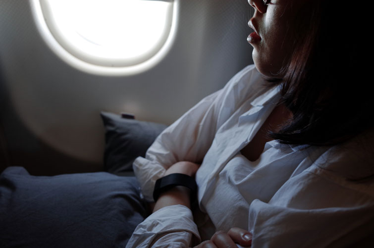 woman sleeping in airplane