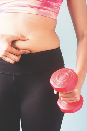 woman showing her belly fat